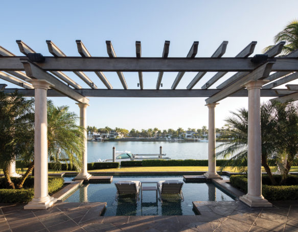 Poolside partial shade of a wooden tech-enhanced pergola